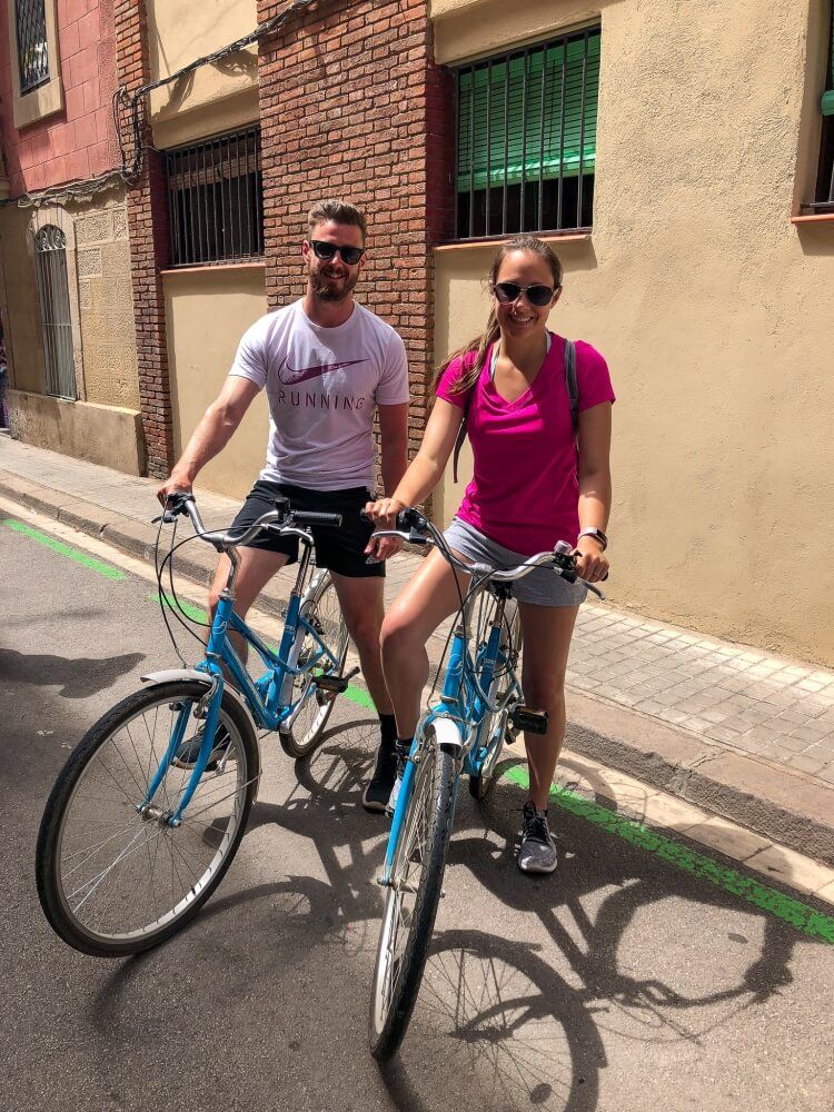 Mark and Kristen biking during a weekend in Barcelona