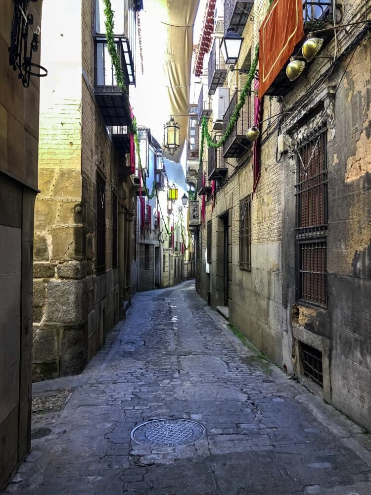 Walking through the narrow streets on a day trip to Toledo