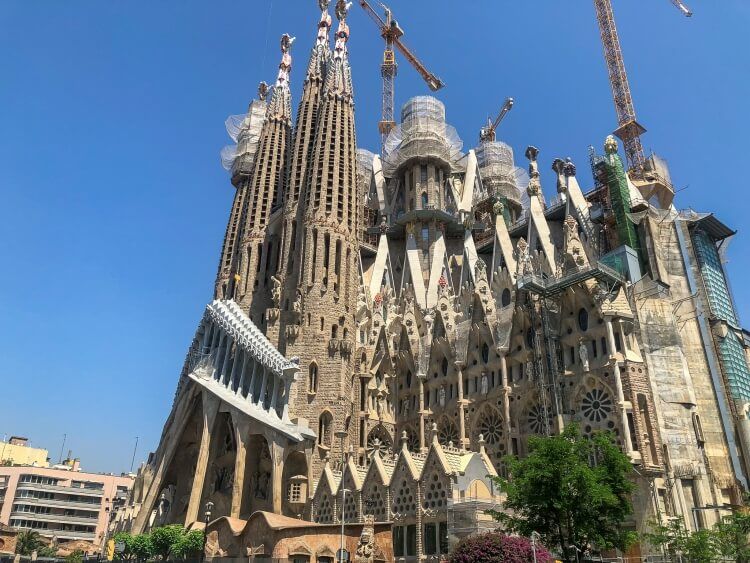 Sagrada Familia with cranes for construction during a weekend in Barcelona