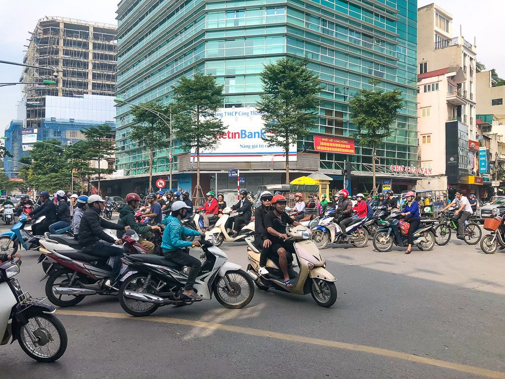 Hectic traffic in Hanoi Vietnam with numerous motorbikes
