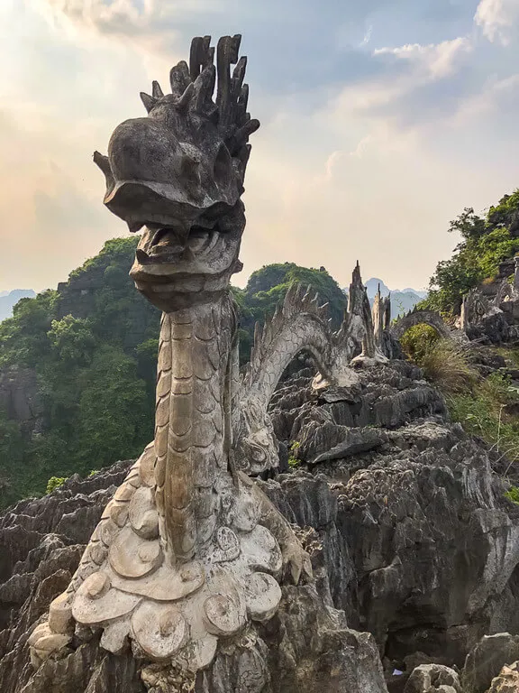 Stone dragon at the summit of Mua Cave viewpoint