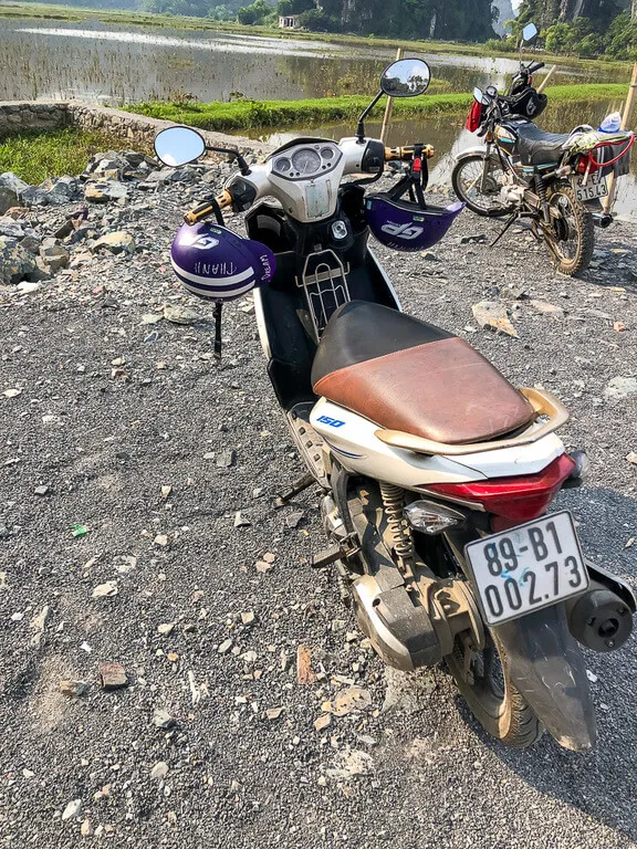 Motorbike parked next to the entrance to Mua Cave Viewpoint in Tam Coc