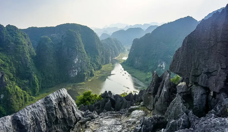 Gorgeous deep green trees on mountains with a river running through