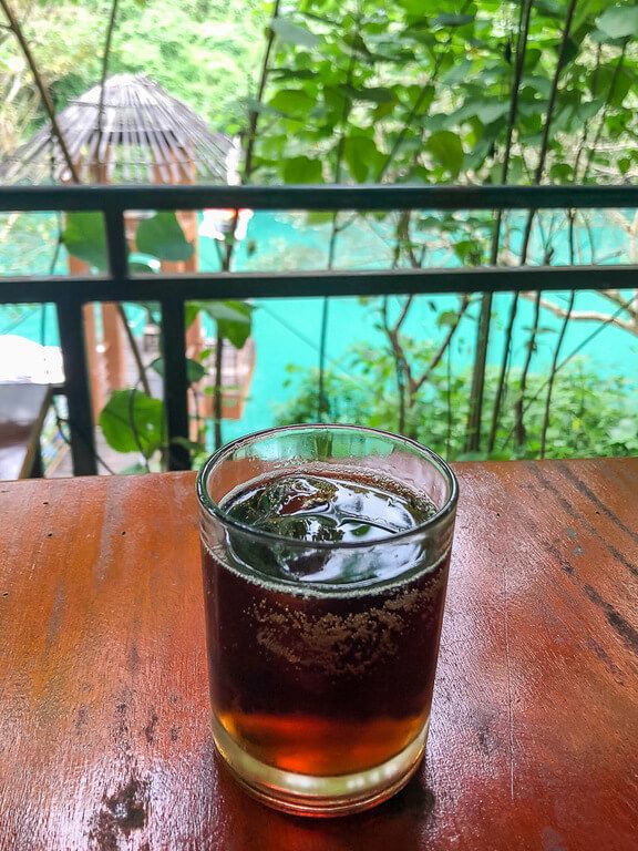 A rum and coke on a table in Phong Nha