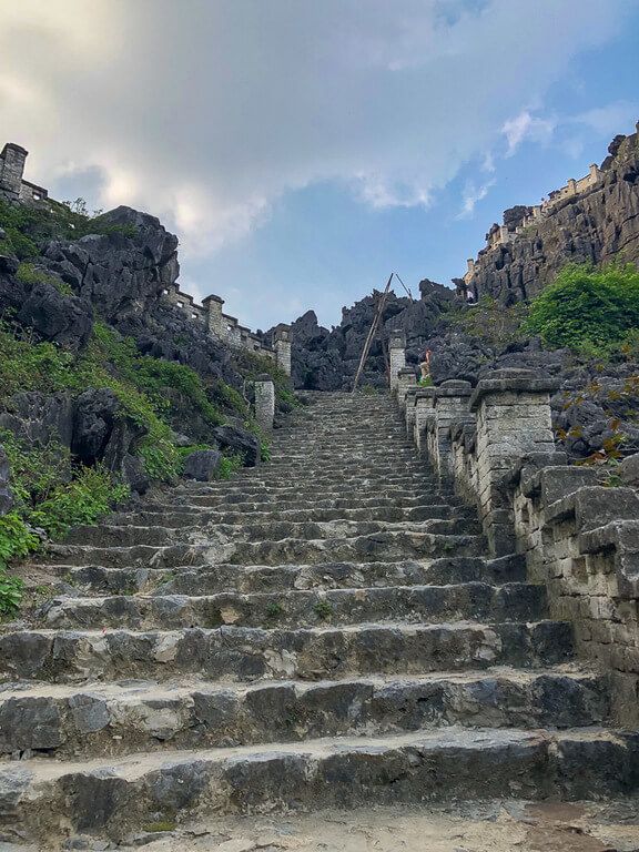 A mysterious stone staircase leading up to a stunning viewpoint Ninh Binh