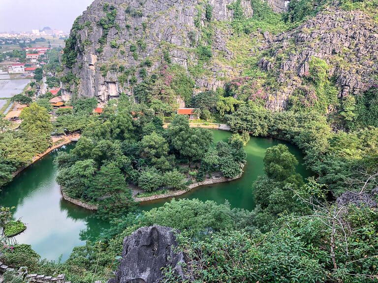 View of the main entrance from a few steps up towards the viewpoint at Mua Cave in Ninh Binh Vietnam