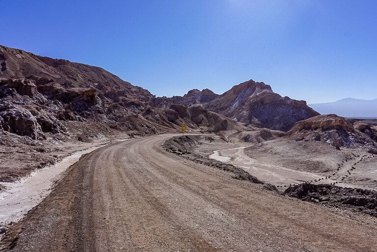 dirt road in Valle de la luna bending through rocky terrain