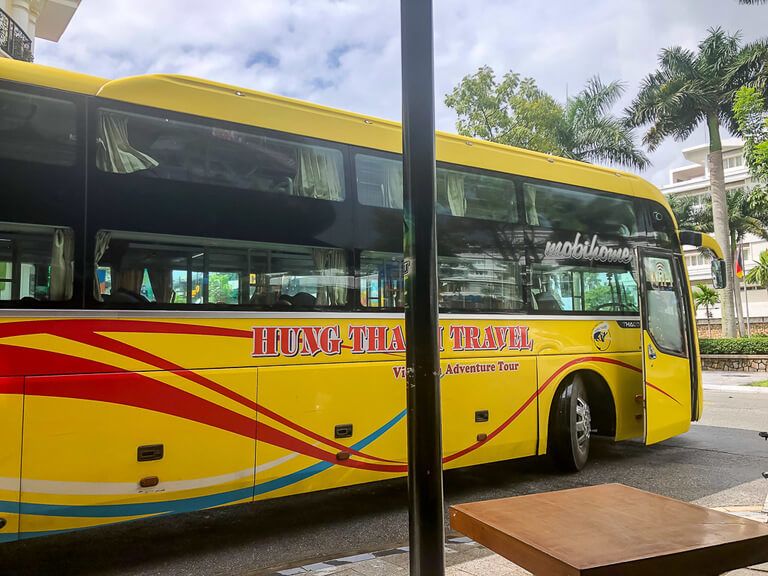 A yellow sleeper bus in Phong Nha