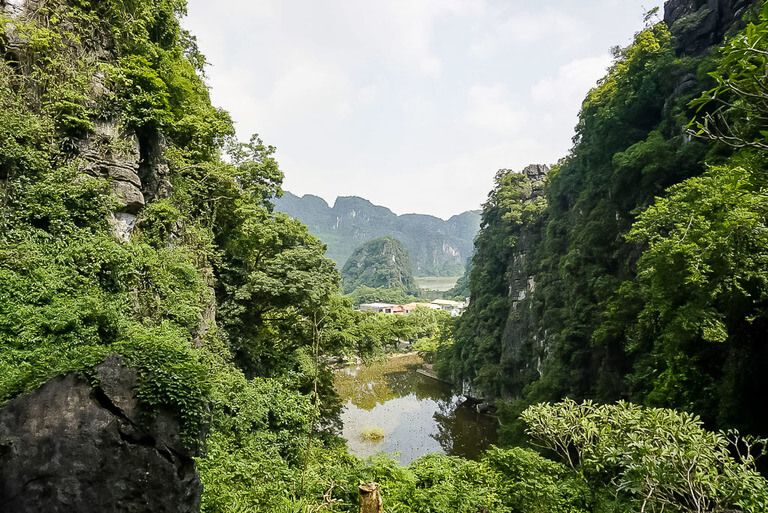 View of the lake and limestone mountains in the third tier of Bich Dong