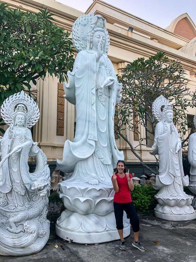 Kristen stood in front of marble statue in Da Nang