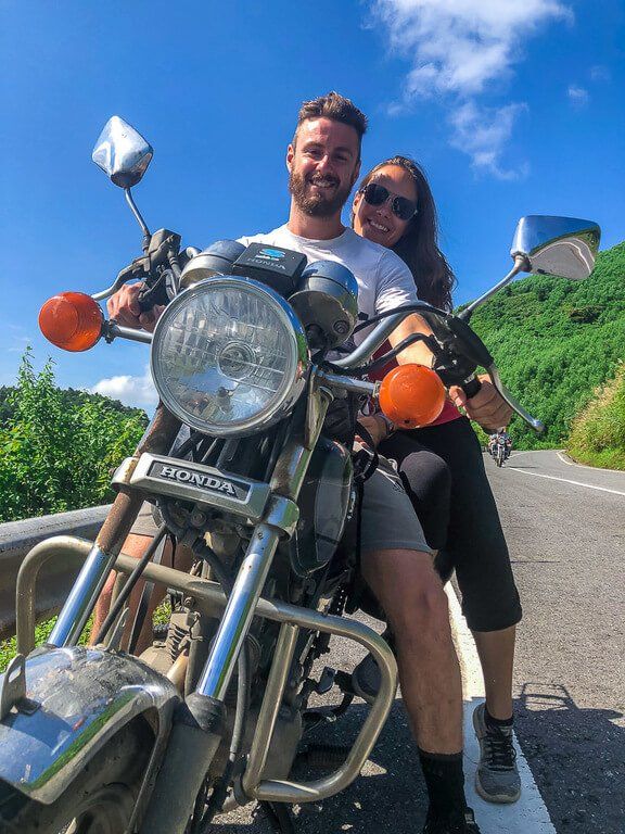 Mark and Kristen on guides motorbike on hai van pass