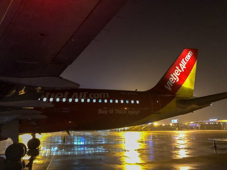 VietJet Air plane on Hanoi tarmac yellow and red paint at night
