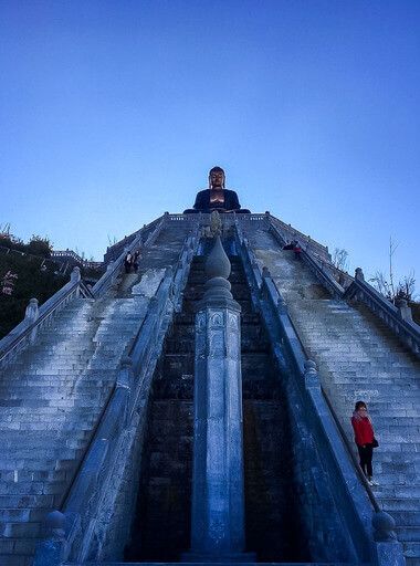 Gorgeous symmetrical staircases flanking each side of buddha statue Fansipan vietnam