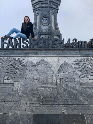 Kristen sat on Fansipan mountain letters made of stone sapa vietnam
