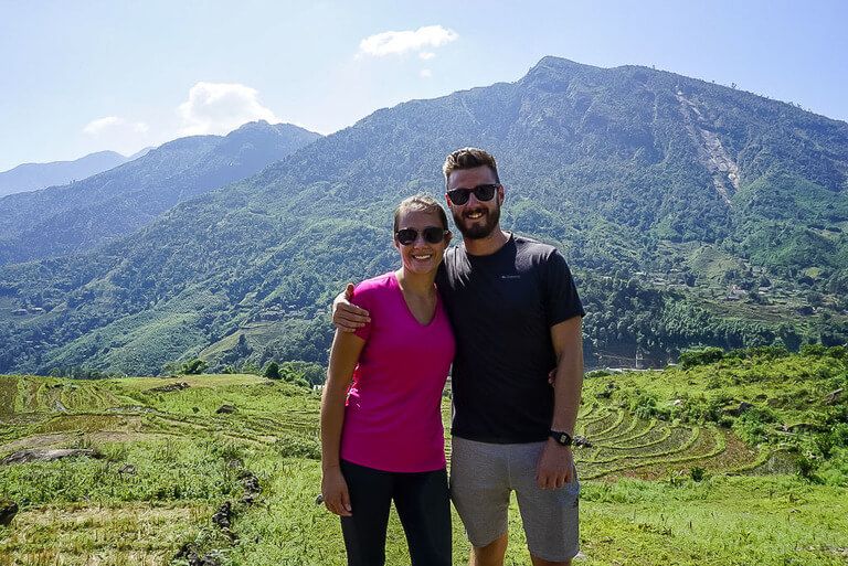 Mark and Kristen enjoying the sun on rice paddies trekking sapa vietnam