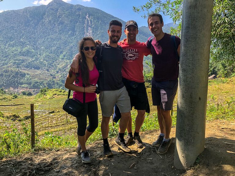 Mark Kristen and two Spanish men smiling in a group in sapa vietnam trekking
