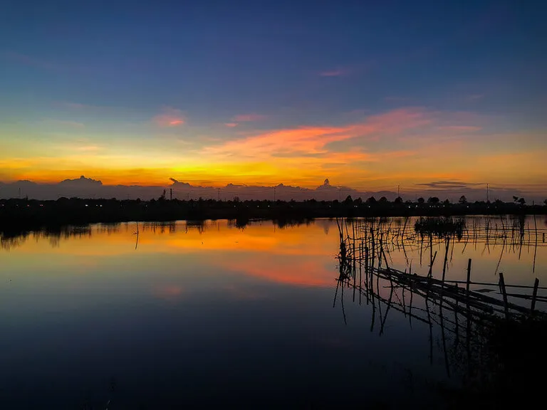 sunset in Hoi An after arriving from da nang gorgeous yellows and oranges in sky