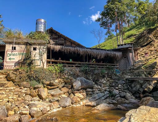 wooden restaurant next to waterfall sapa valley Vietnam