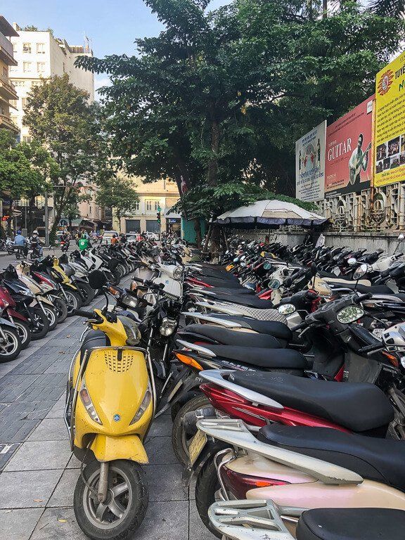One things to know about Vietnam is that motorbikes are life sidewalk packed full of scooters