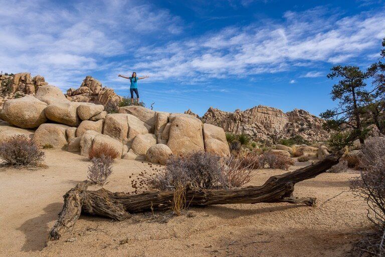 Kristen on top of rocks in hidden valley Joshua Tree national park