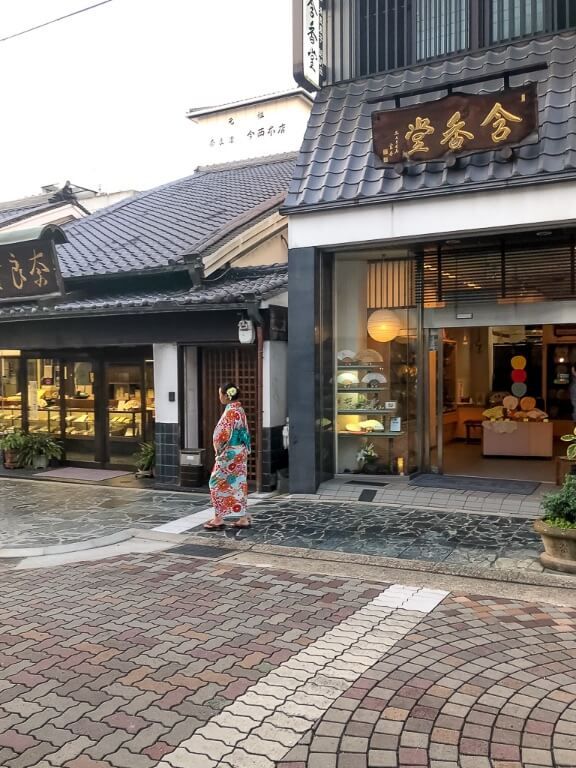 Woman in Kimono Japanese city walking around shopping district