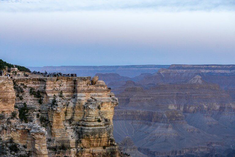Mather Point at sunrise is busy with tourists who can't miss an epic sunrise
