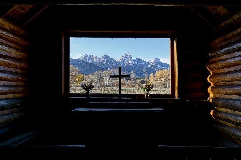 Iconic photograph through window chapel of transfiguration grand teton national park best things to do