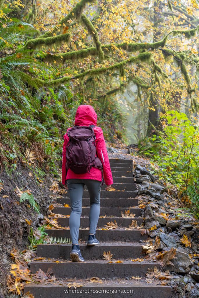 Woman hiking up a stone staircase in Washington state