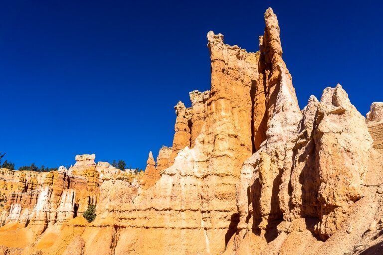 Melted wax sandstone hoodoos in utah national park against a deep blue sky