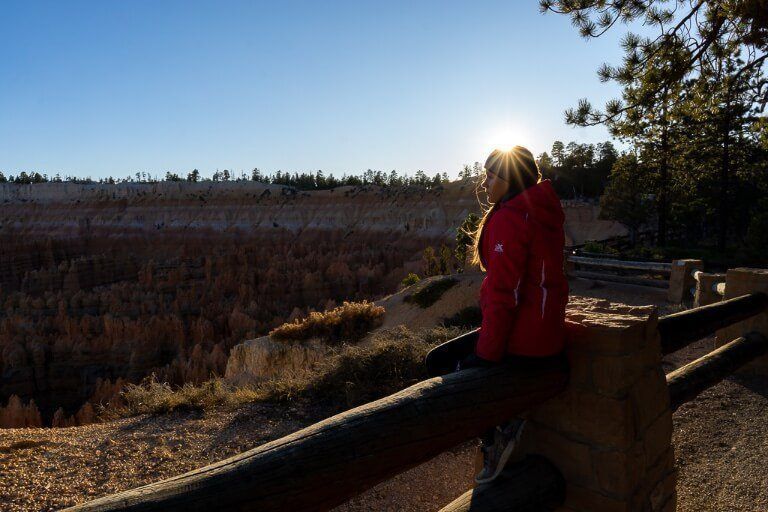 Kristen at sunset with a starburst over her head bryce canyon sunset photography