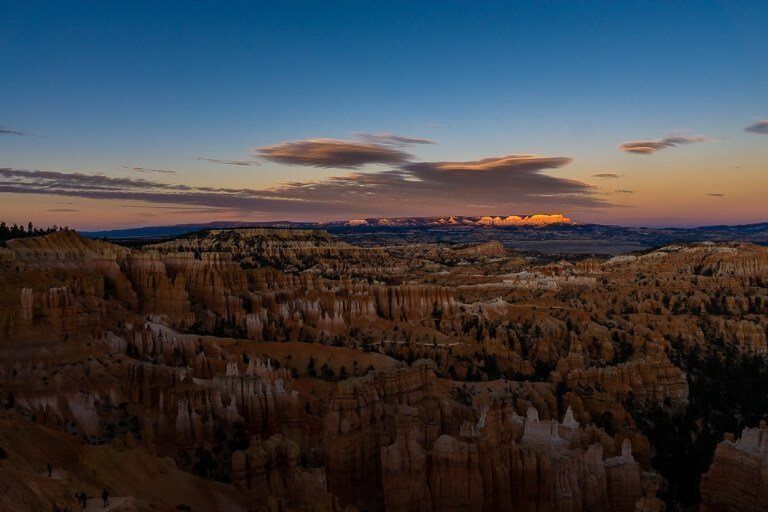 Incredible colors in the sky for Bryce Canyon sunset at sunset point over the impressive hoodoo valley below