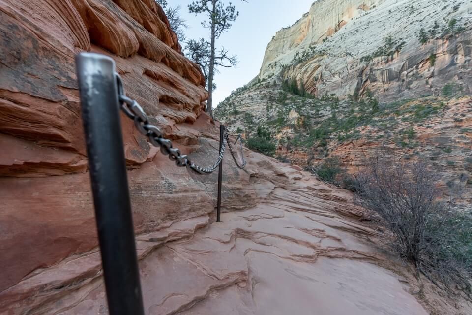 Chain to grab hold of when hiking a trail in Utah on orange rocks