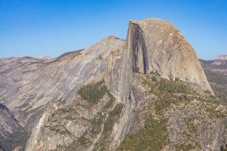 Half Dome photography Yosemite National Park California taken from Glacier Point Zoomed in to show severity of cut in rocks
