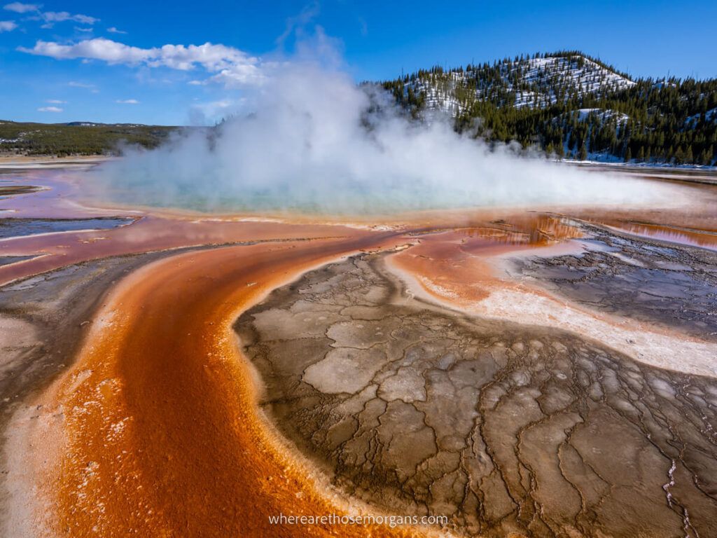 Grand Prismatic Spring vibrant colors swirling and light steam billowing