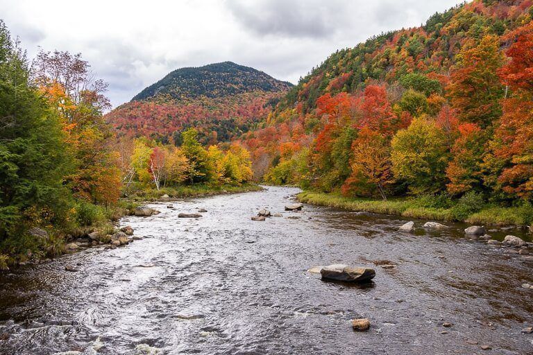 Ausable River running through stunning fall foliage in adirondacks new york