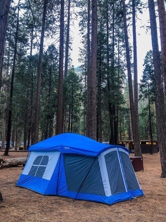 Blue tent in forest at upper pines campground where to stay in yosemite national park