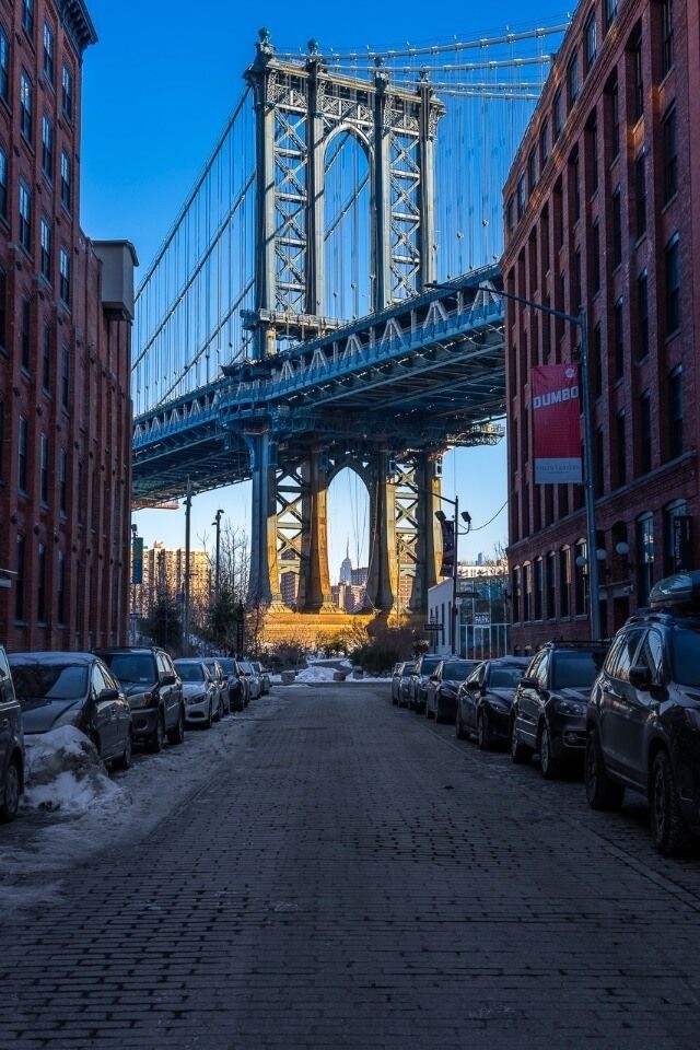 Awesome NYC Photography Manhattan Bridge lighting up at sunrise on washington street in dumbo brooklyn new york city
