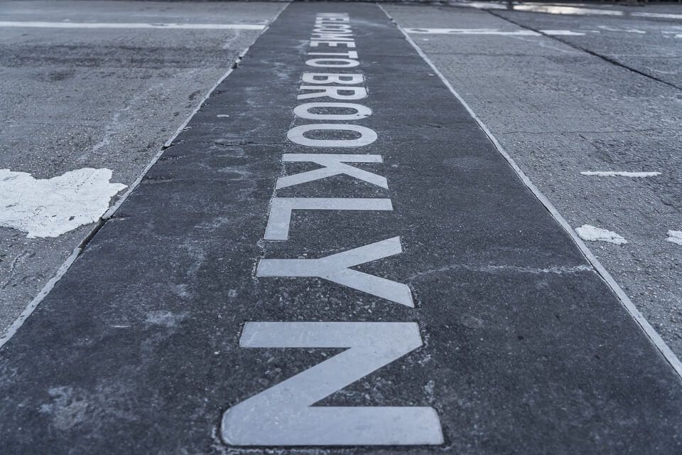 Welcome to Brooklyn sign painted on ground in new york city
