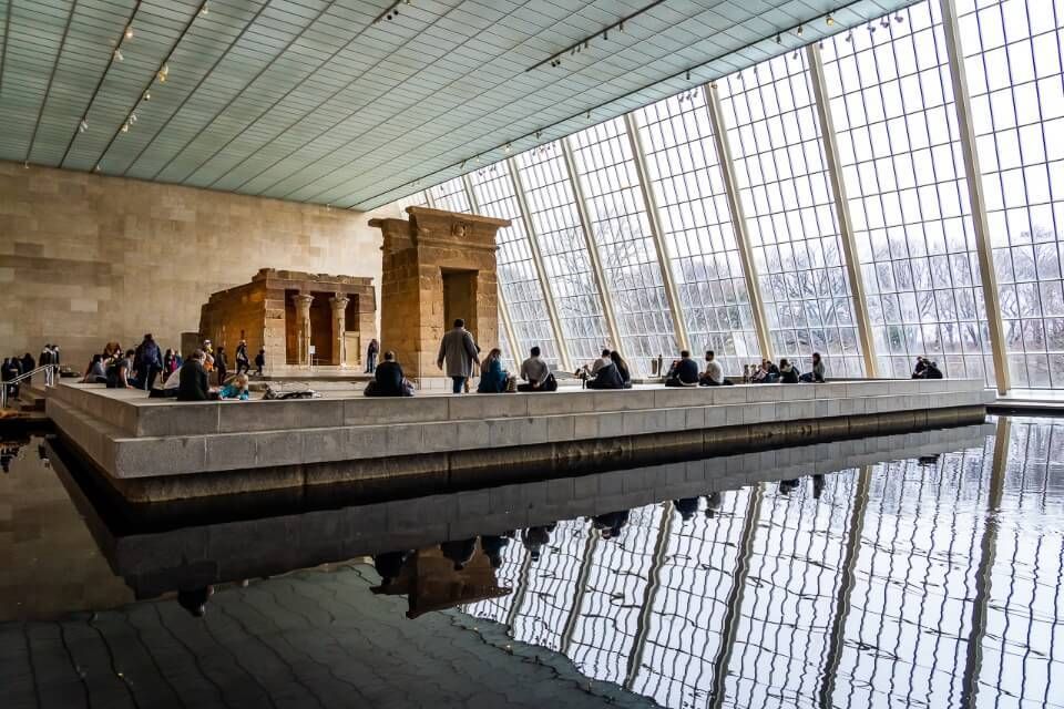 Visitors walking through exhibits in the Metropolitan Museum of Art in NYC