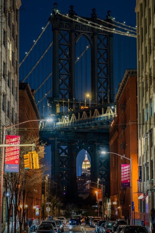Dumbo Brooklyn Washington street at night manhattan bridge column empire state building