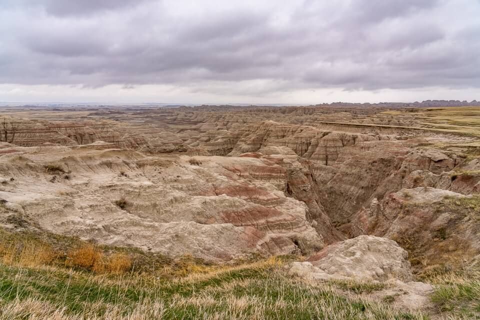 Stunning Badlands National Park landscape in South Dakota with thick clouds in the sky