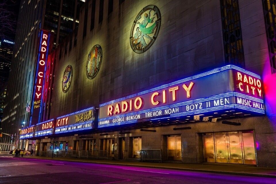 Radio City lights at night Rockettes Show at Christmas in one of the best things to do in NYC in Winter