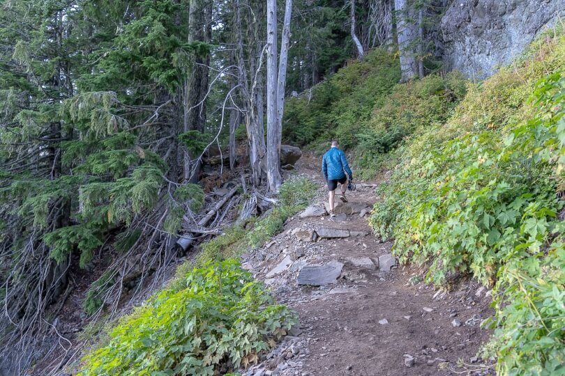 Steep hiking trail man with coat and gloves in washington