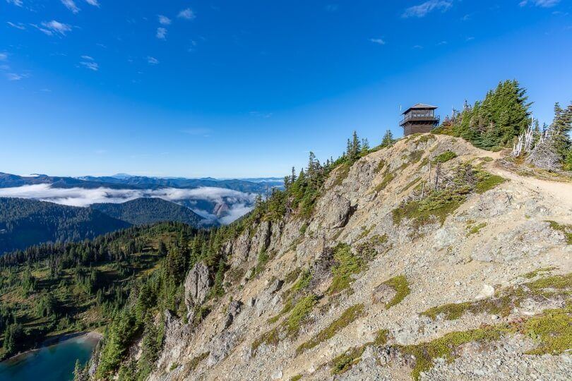 Tolmie Peak Lookout Fire Watchtower high above clouds in valley