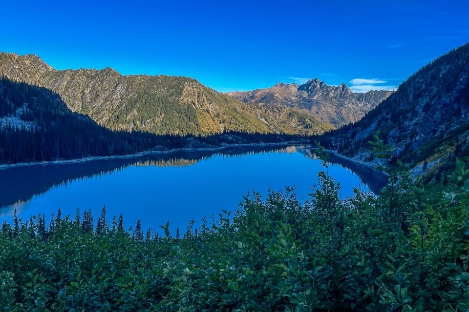 Looking back at Colchuck Lake from Aasgard Pass after sunrise
