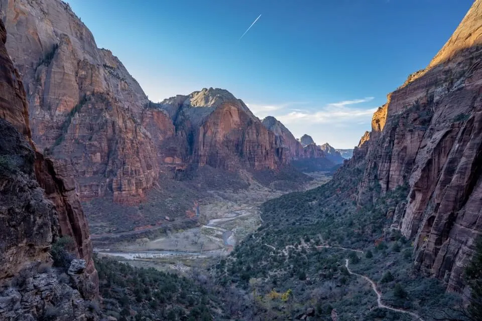 Sunrise over a canyon in Utah with blue sky