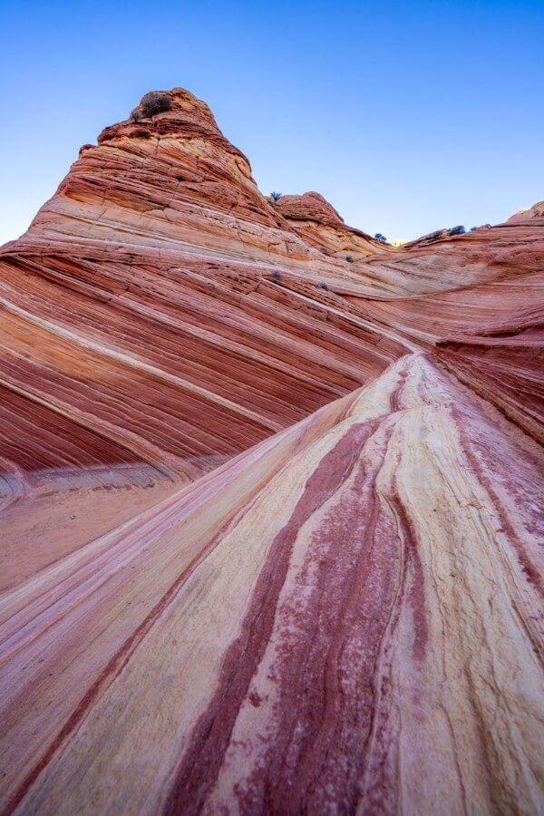 Purple patterns on a unique rock formation in coyote buttes north with blue sky