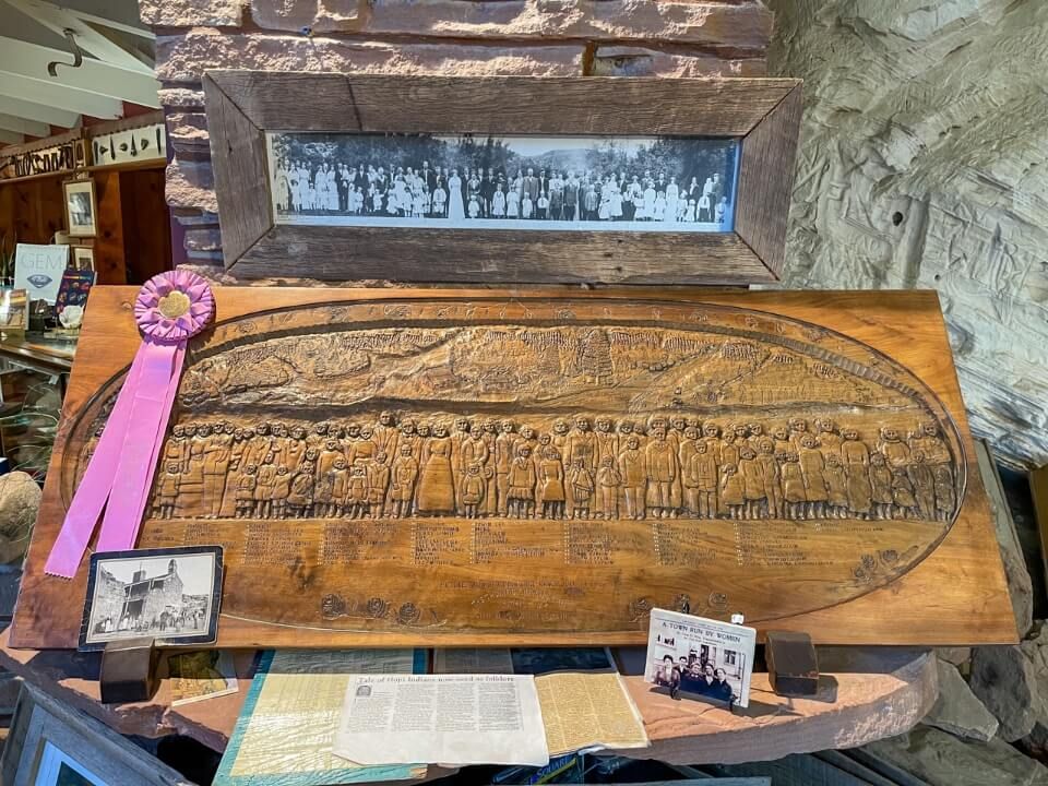 Wooden plaque carving of a family in southern utah