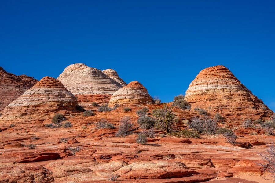 Smooth sandstone domes on a hike in arizona with blue sky