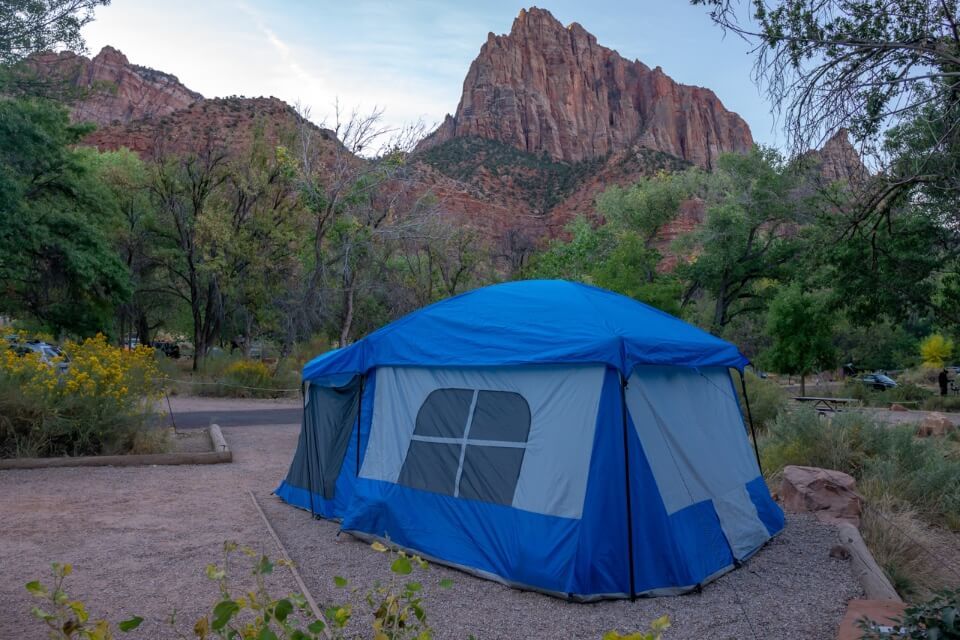 Camping in Watchman Campground with a big blue tent in Zion National Park best place to stay if you can't get a hotel in Springdale
